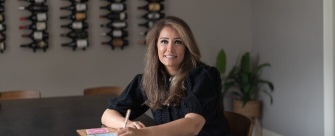 Cecilia Smith writing at a desk